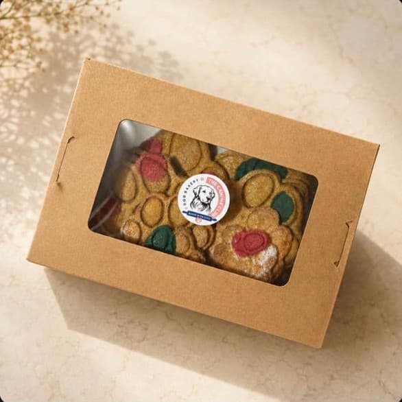 Themed cookies with colour splashes in a windowed box